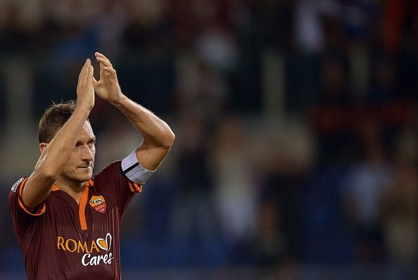 Francesco Totti greets supporters at the end of the Serie A football Roma vs Bologna at the Olympic Stadium on September 29, 2013 in Rome. (Getty Images)